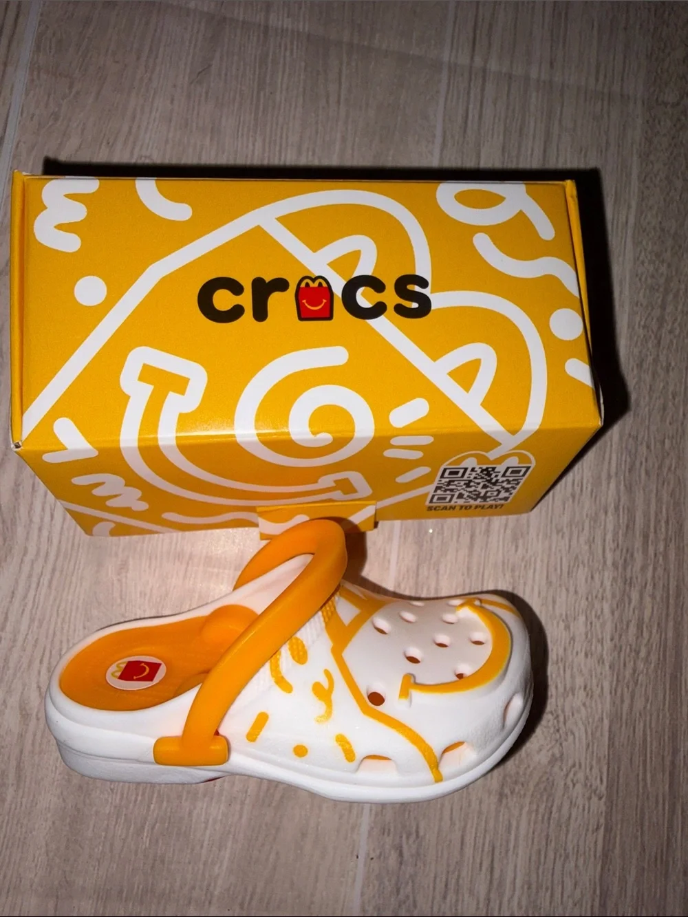 CROCS Collectible White and Orange Smiley